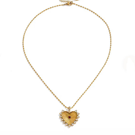Gold heart-shaped pendant necklace on a white background