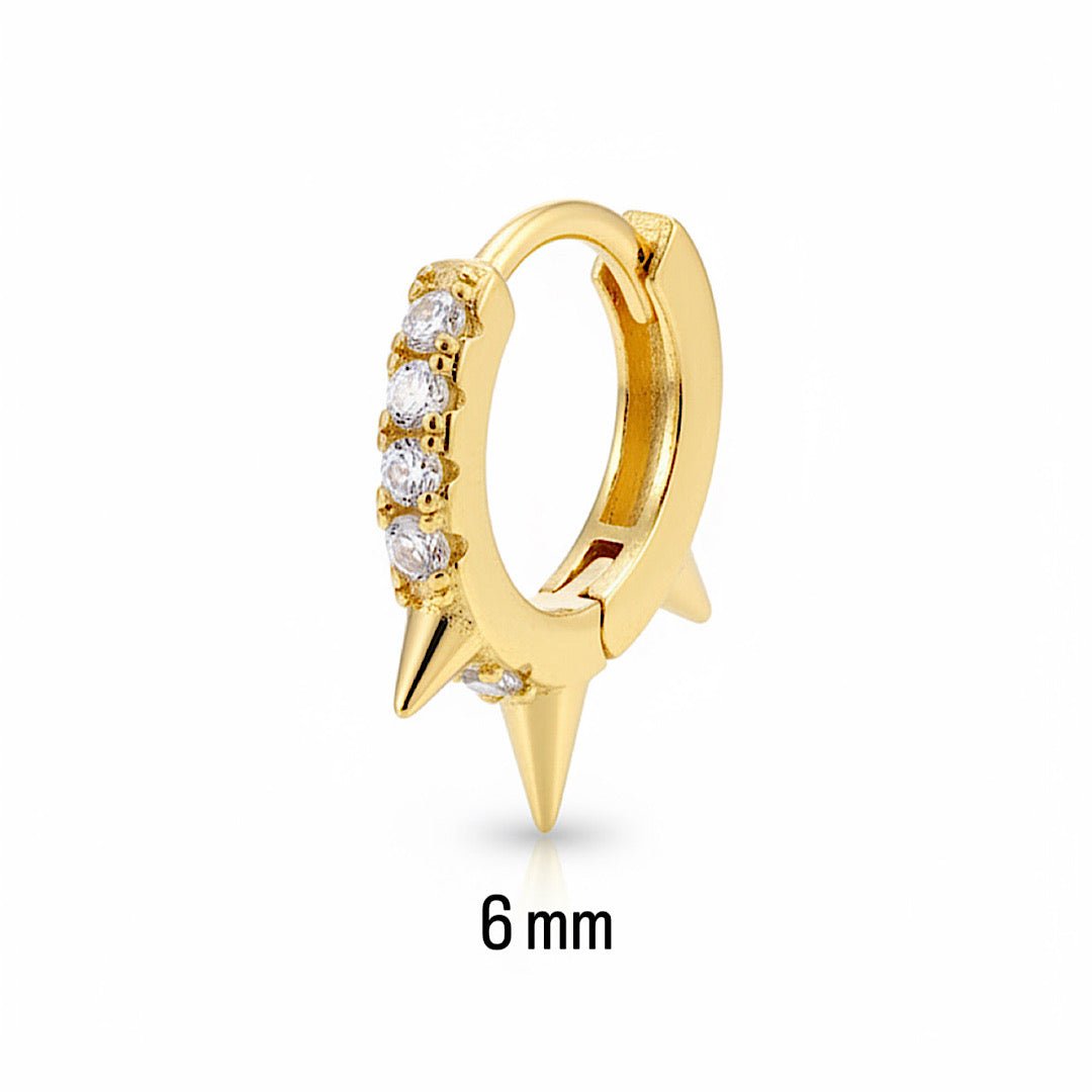 Gold earring with a spike design and small diamonds on a white background