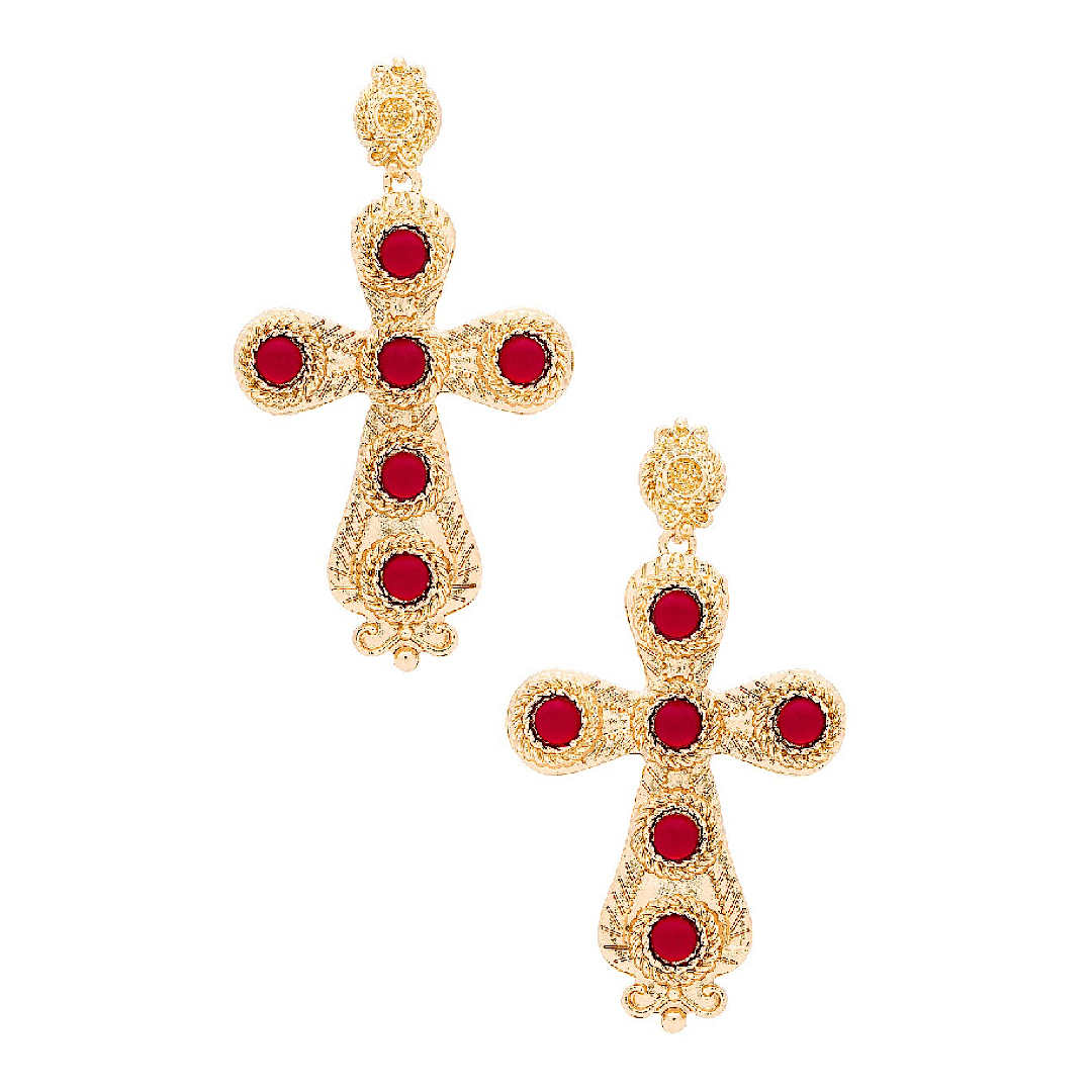 Gold cross-shaped earrings with red gemstones on a white background