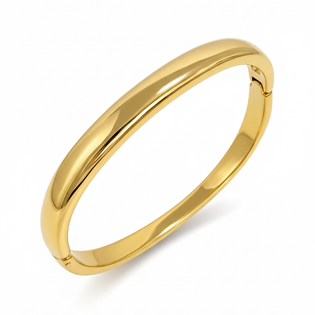 Gold bangle on a white background